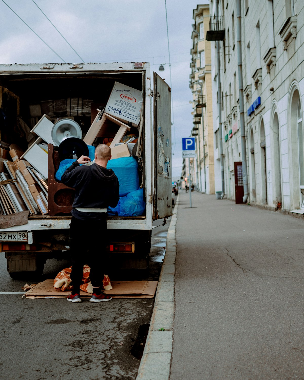 A Professional Movers Pleasanton crew member carefully loading furniture into a moving truck